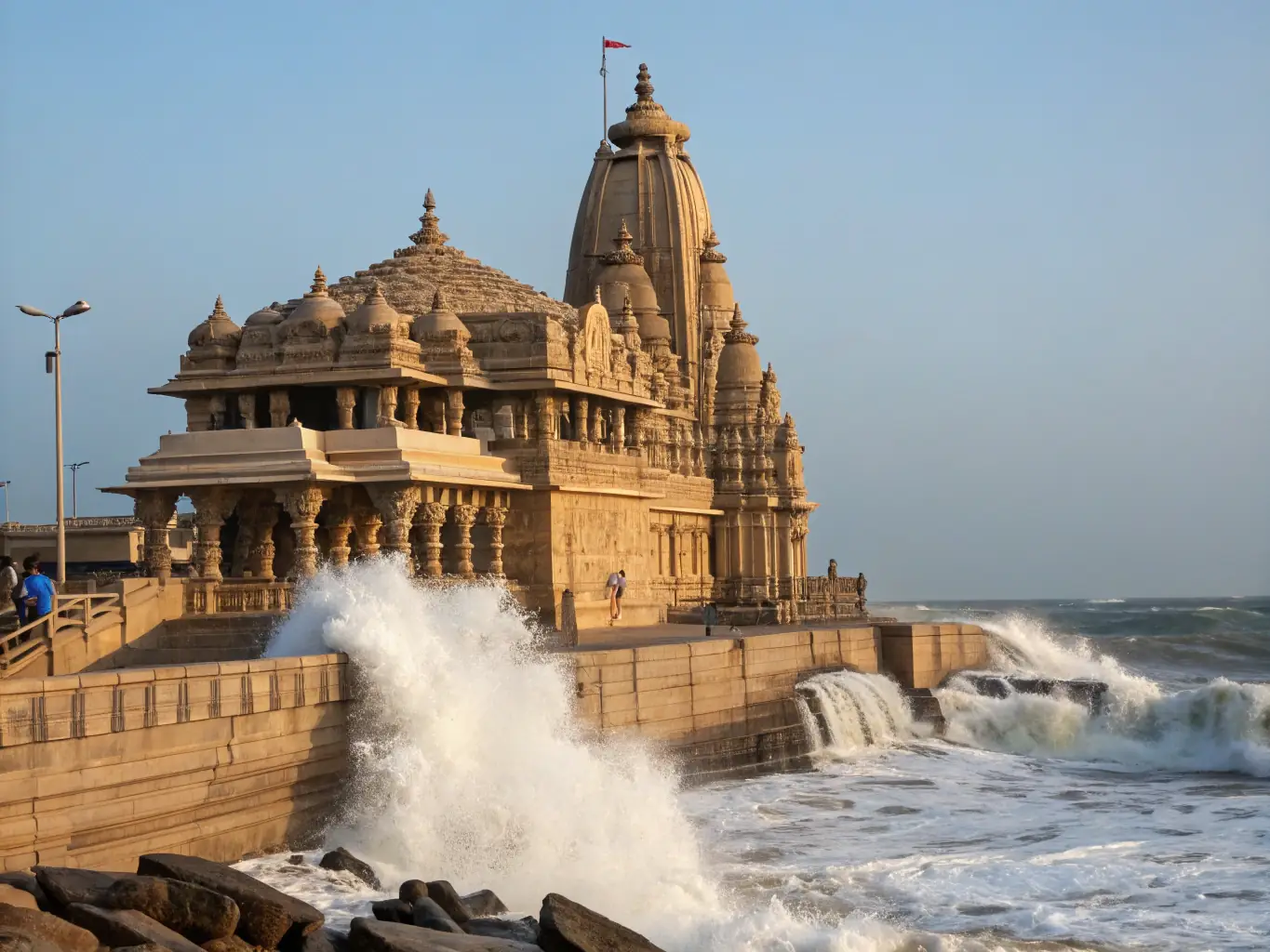 A detailed shot of the intricate architecture of the Somnath Temple in Gujarat, with the ocean waves crashing nearby, symbolizing resilience and devotion.